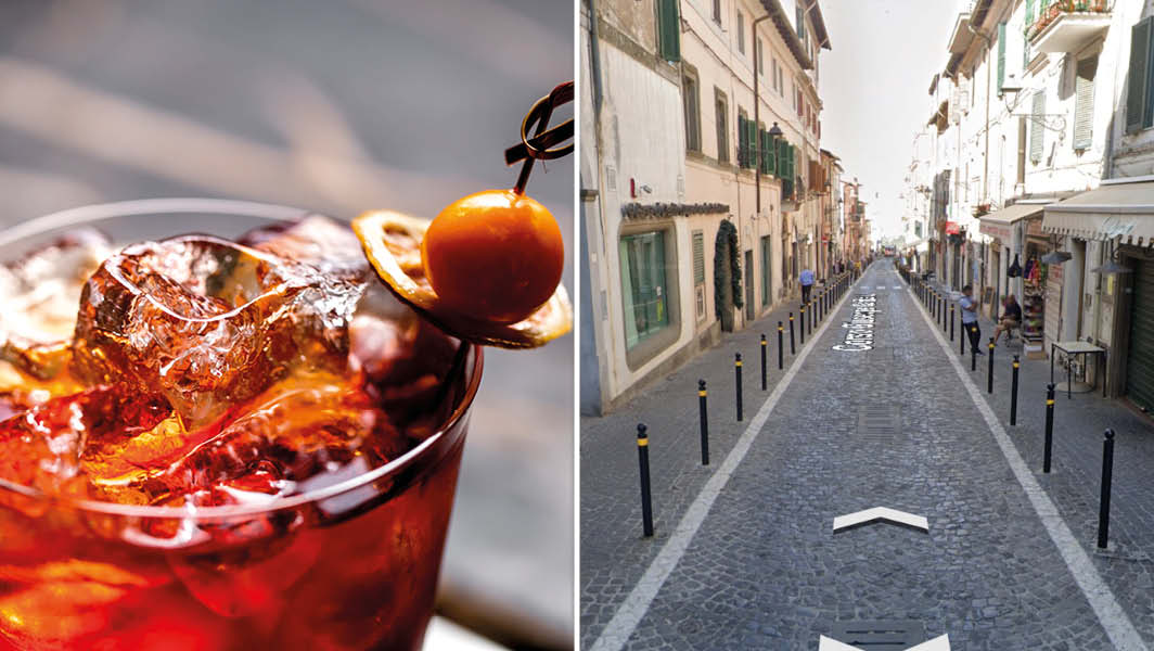 Ariccia: un bicchiere con un cocktail su ghiaccio e uno scorcio della centralissima Corso Garibaldi.