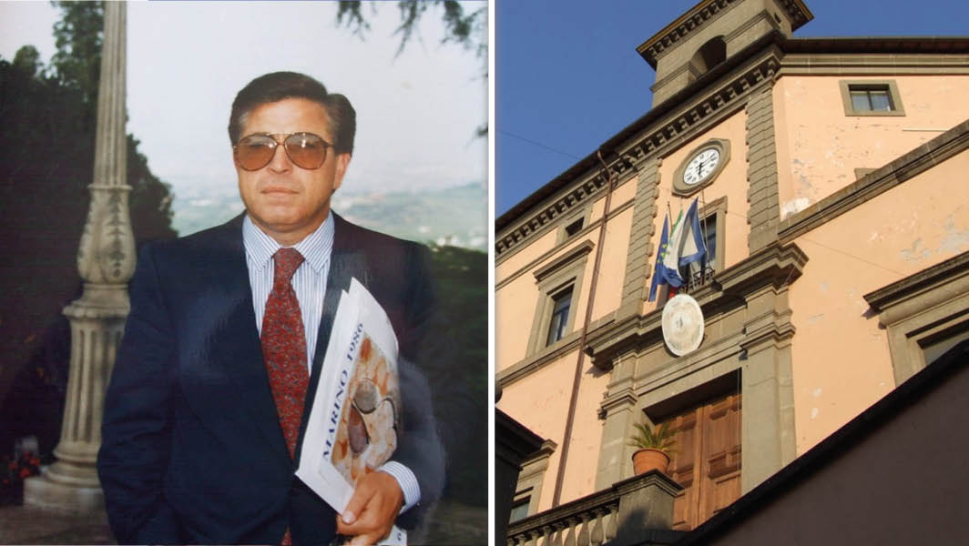 Ritratto di Leonardo Massa, ex sindaco di Marino, con in mano un documento; a destra, il Palazzo Comunale di Marino con bandiere esposte.